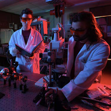 Physics students working in a lab